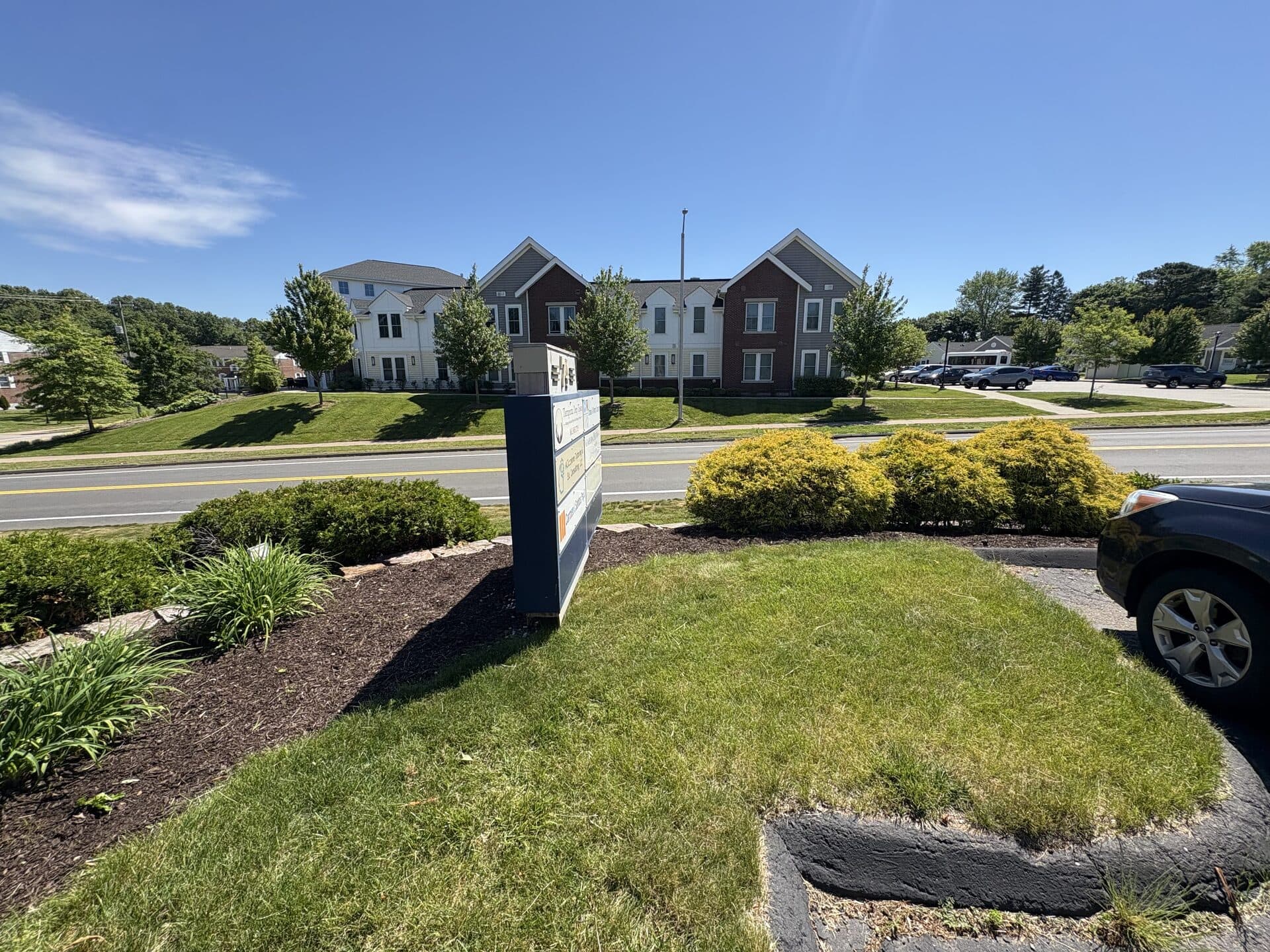 Mixed perennial and shrub garden bed with fresh mulch