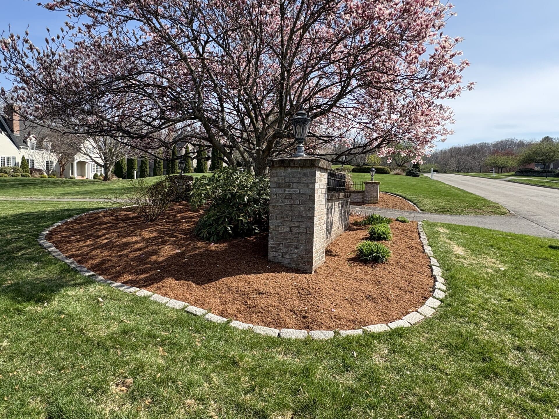 Block retaining wall holding back a raised planting bed