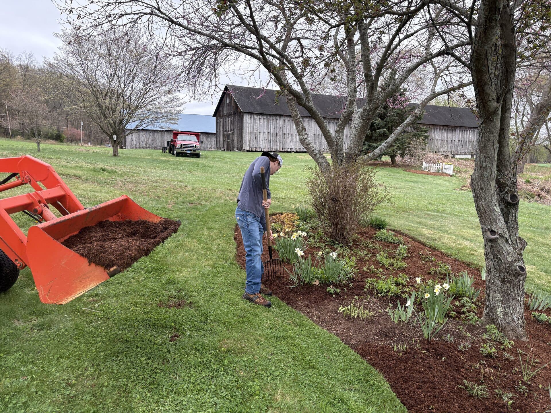 Curved paver walkway bordered by planting beds